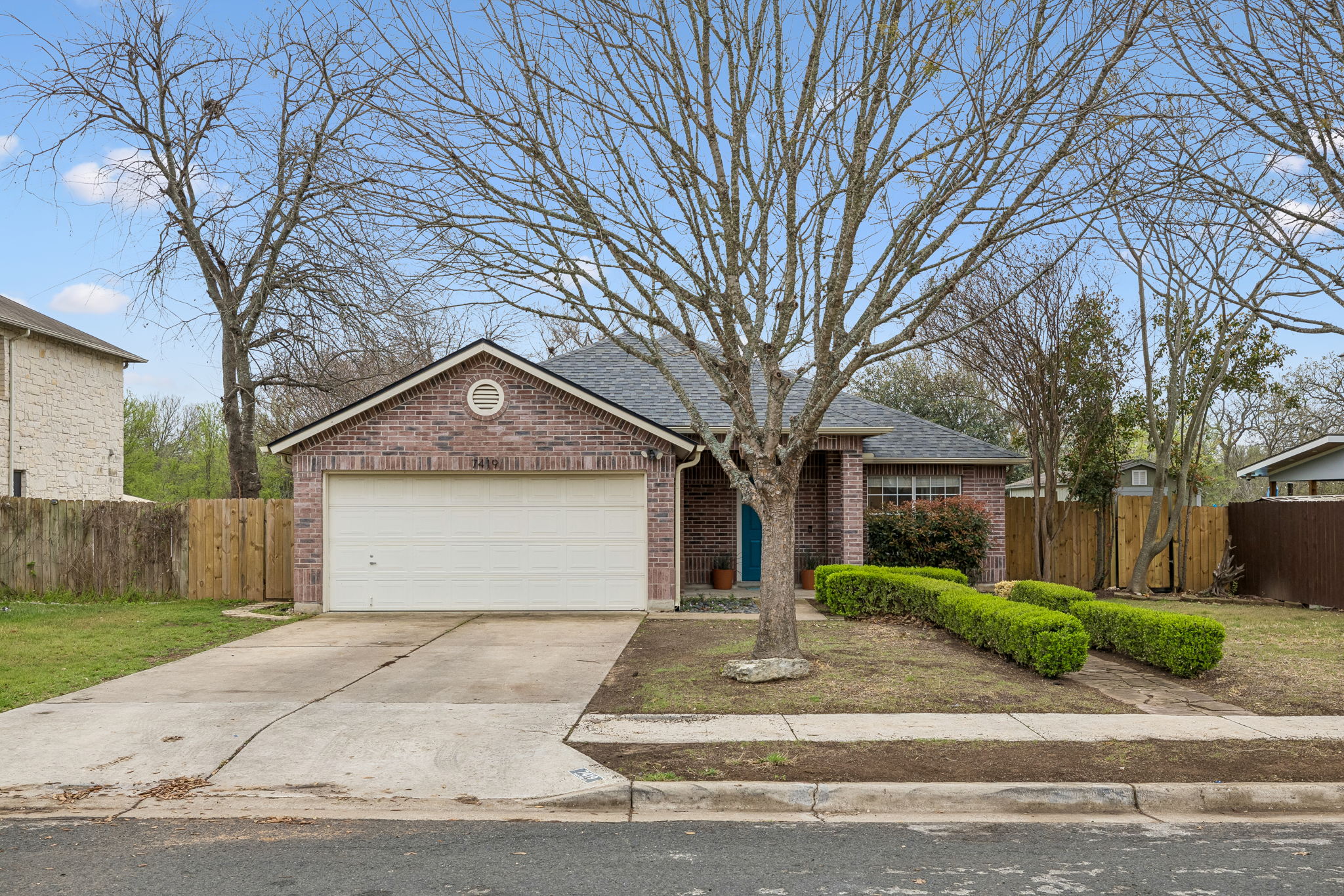 7419 Pusch Ridge Loop Austin, TX 78749 - Photo 1 of 1 a view of a house with a yard and large tree