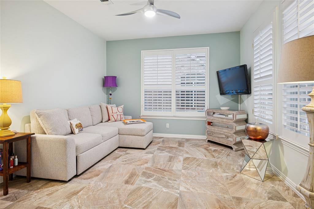125 Bricknell Lane Coppell, TX 75019 - Photo 17 of 27 a living room with furniture and a flat screen tv