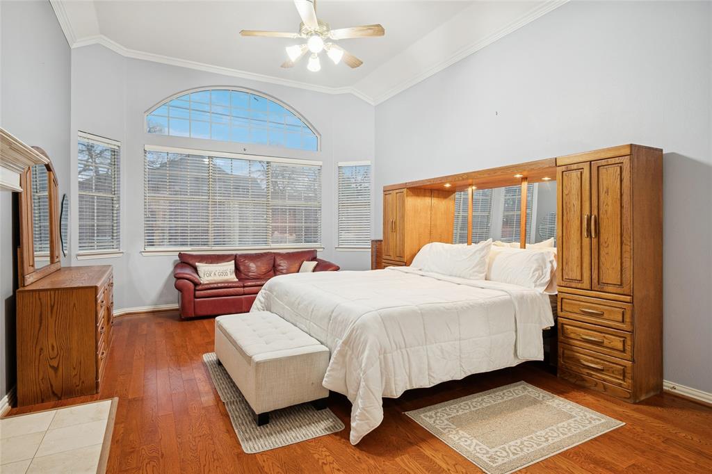 125 Bricknell Lane Coppell, TX 75019 - Photo 18 of 27 a bedroom with a bed couch and window