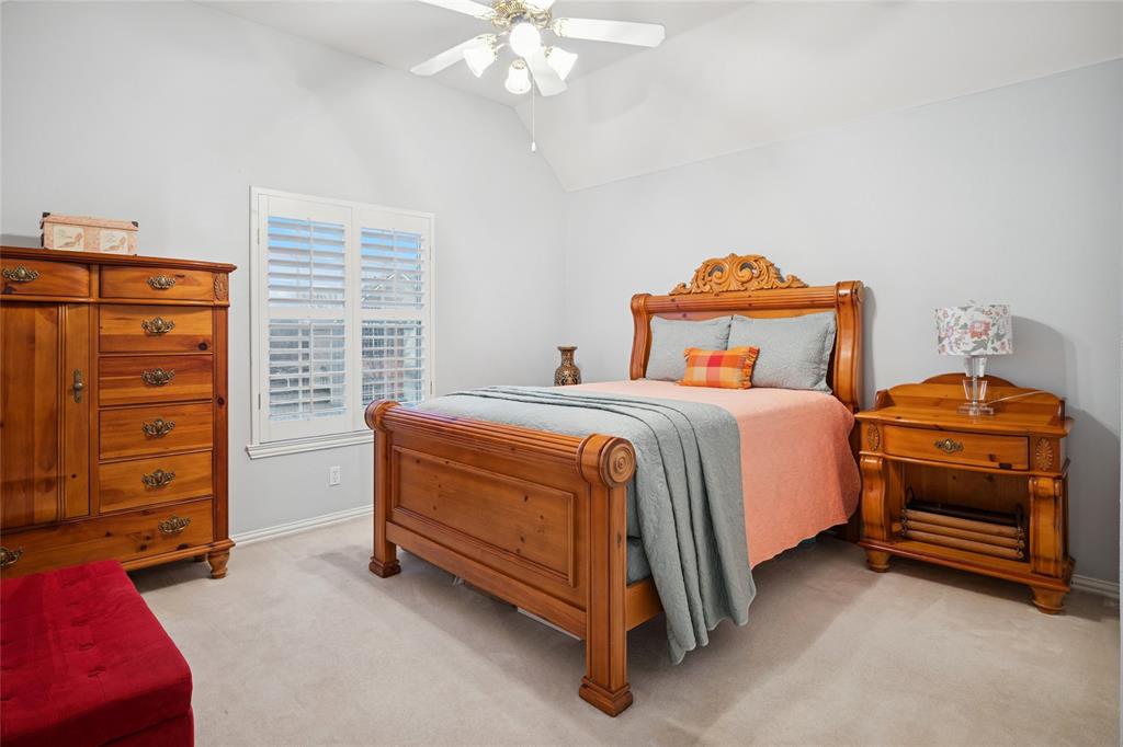 125 Bricknell Lane Coppell, TX 75019 - Photo 22 of 27 a bedroom with a bed and a closet
