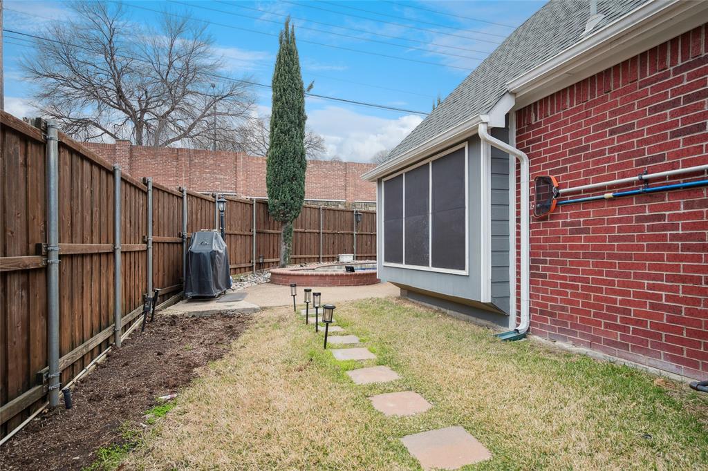 125 Bricknell Lane Coppell, TX 75019 - Photo 27 of 27 a backyard of a house with table and chairs