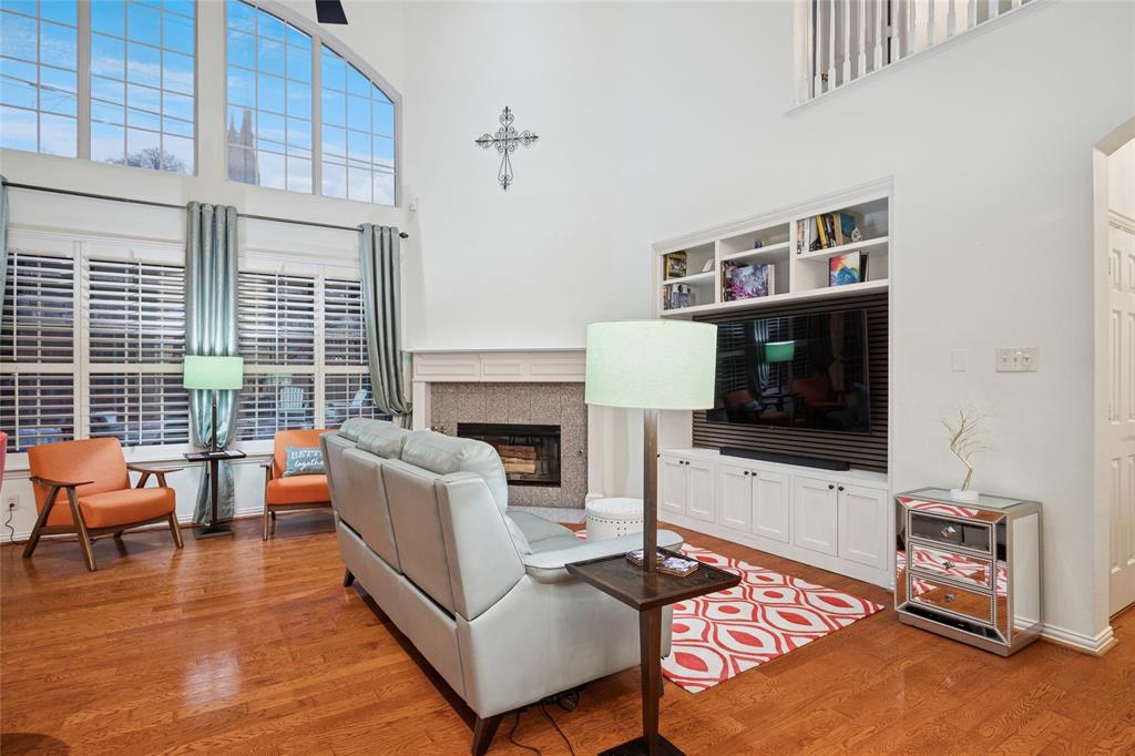 125 Bricknell Lane Coppell, TX 75019 - Photo 7 of 27 a living room with furniture and a fireplace