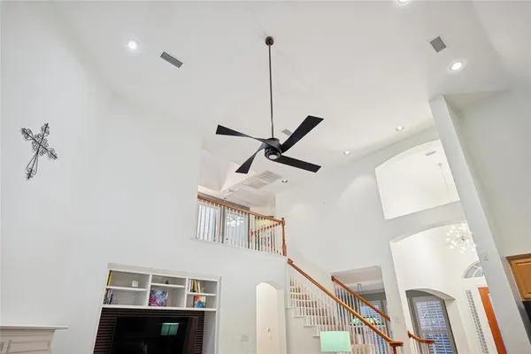 a view of living room with furniture and a fireplace