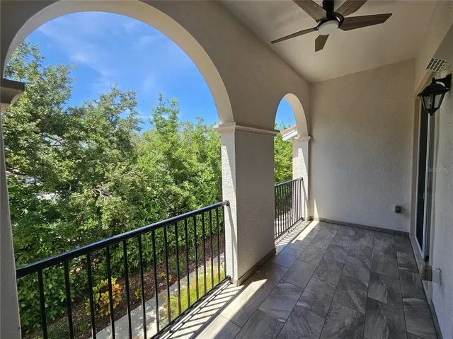 a view of balcony with wooden floor and outdoor seating
