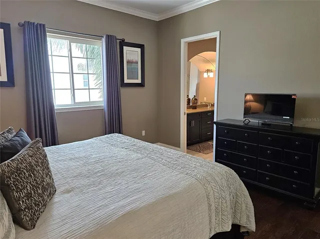 a bathroom with a double vanity sink a mirror and a shower