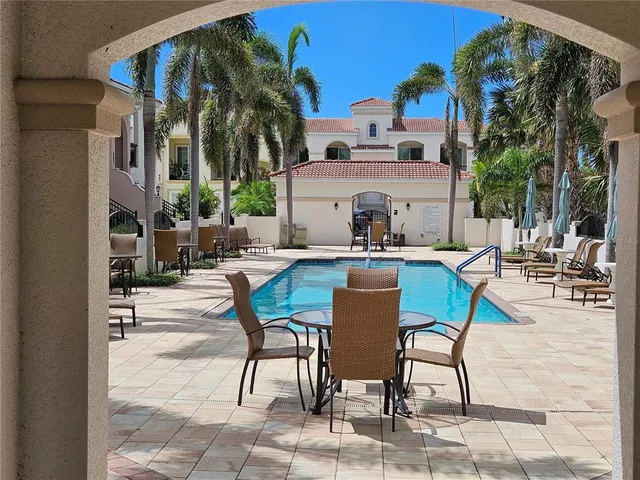 a view of a dinning table and chairs in the patio