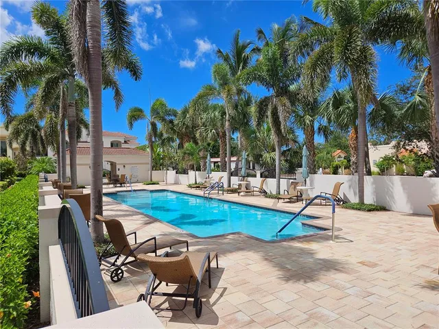 a view of swimming pool with chairs