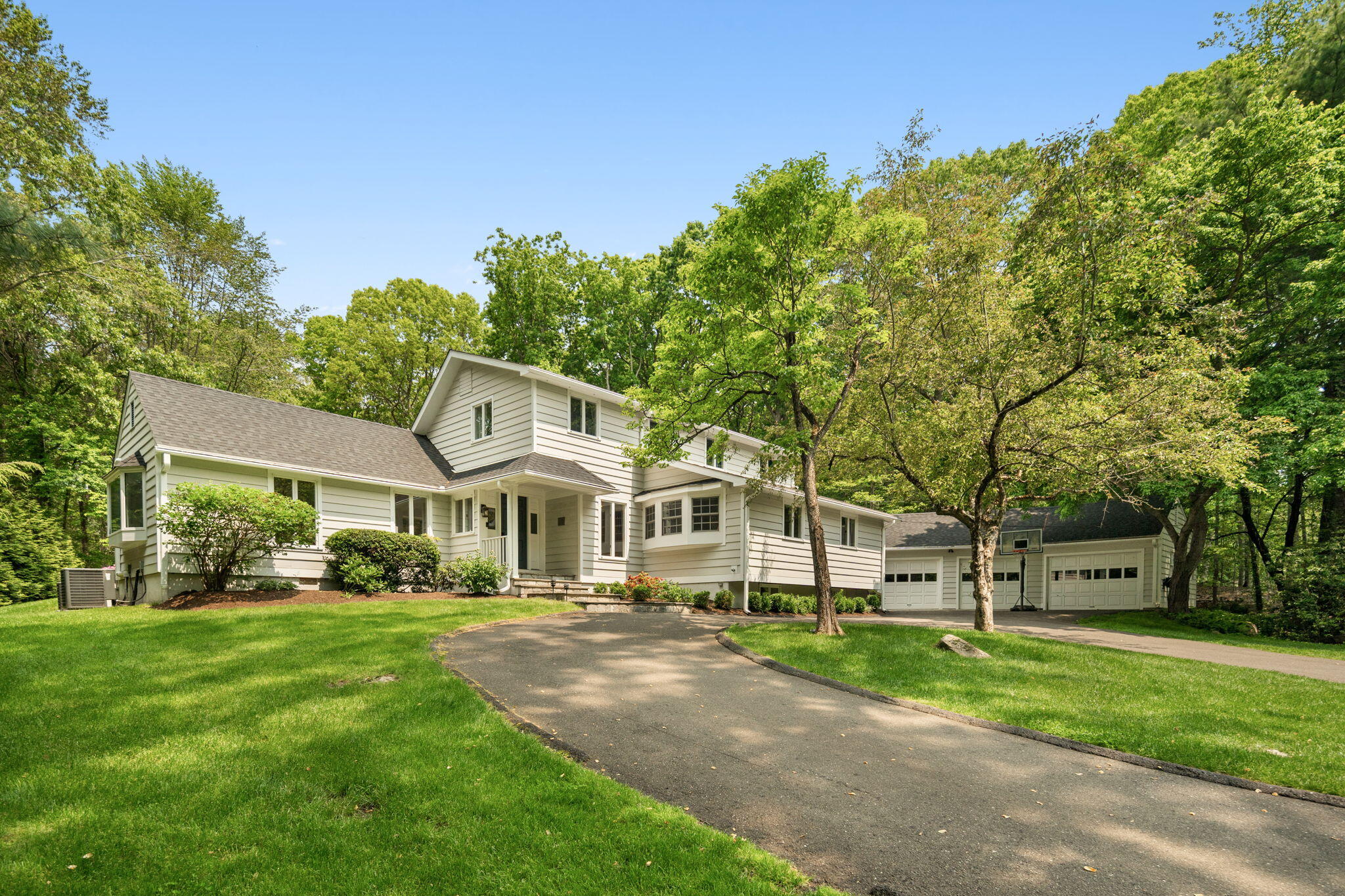53 Fox Run Road New Canaan, CT 06840 - Photo 1 of 39 a front view of a house with a yard
