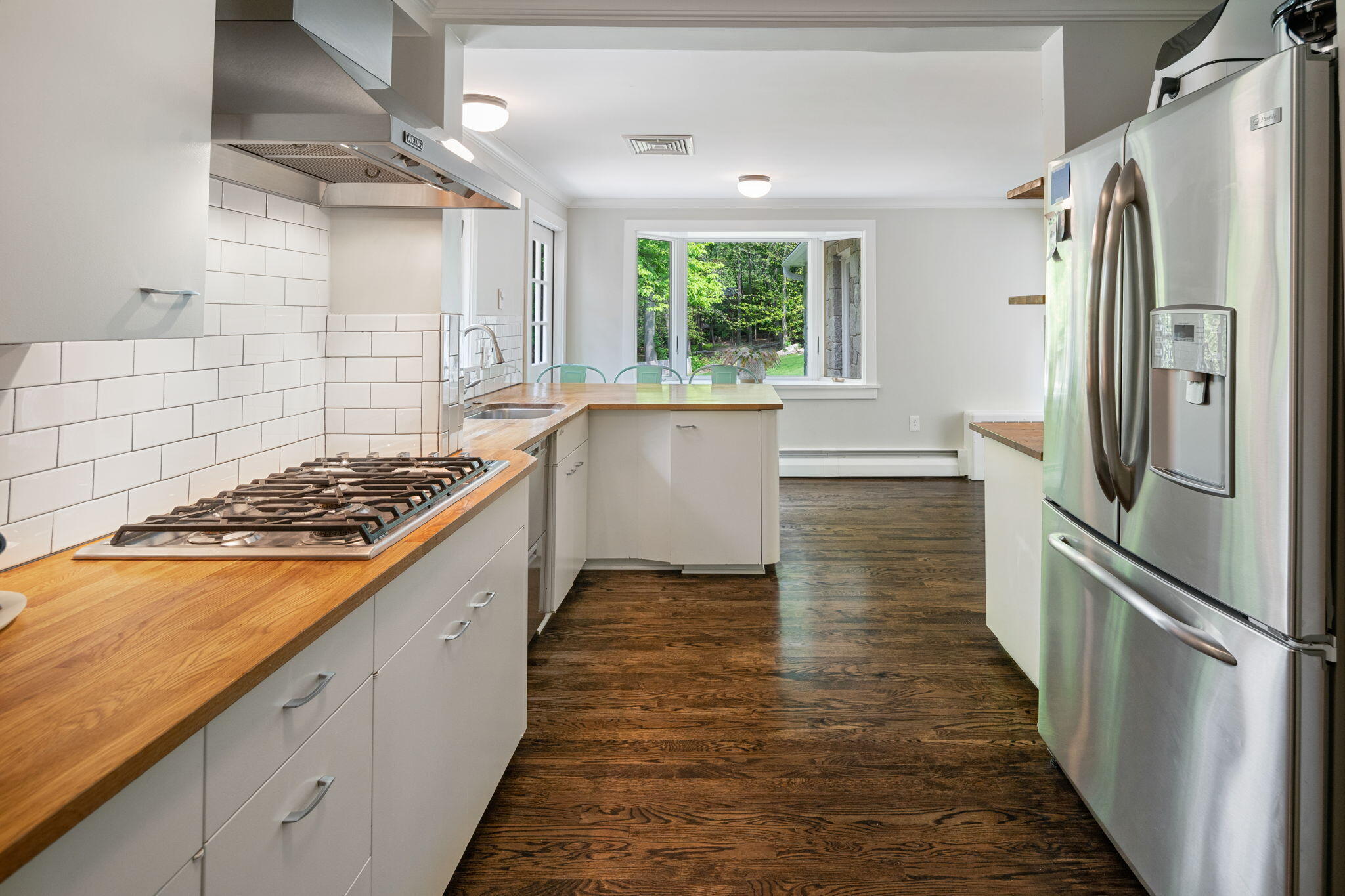 53 Fox Run Road New Canaan, CT 06840 - Photo 12 of 39 a kitchen with a refrigerator a sink and wooden floor