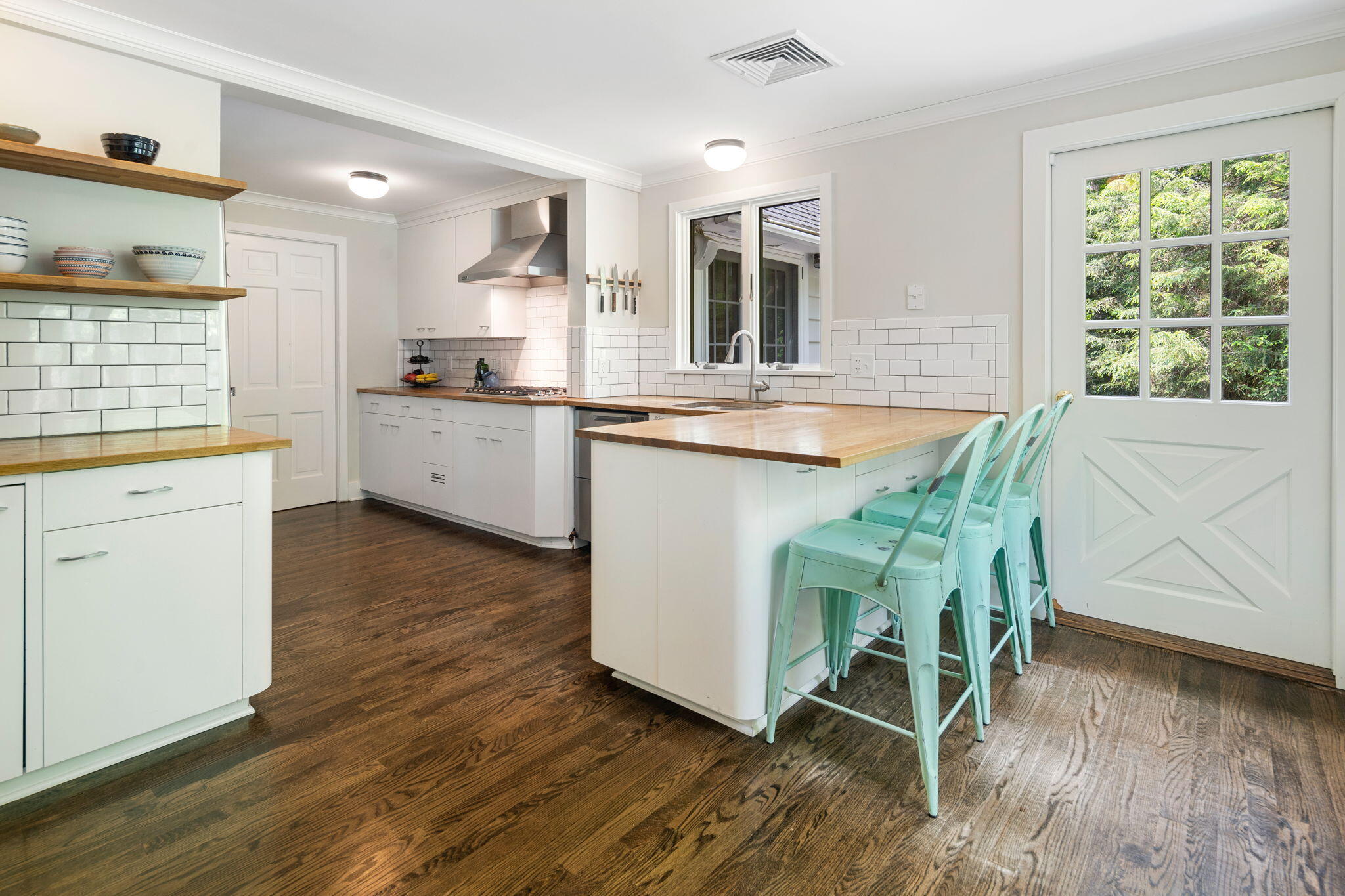 53 Fox Run Road New Canaan, CT 06840 - Photo 13 of 39 a kitchen with stainless steel appliances granite countertop a white cabinets and wooden floor
