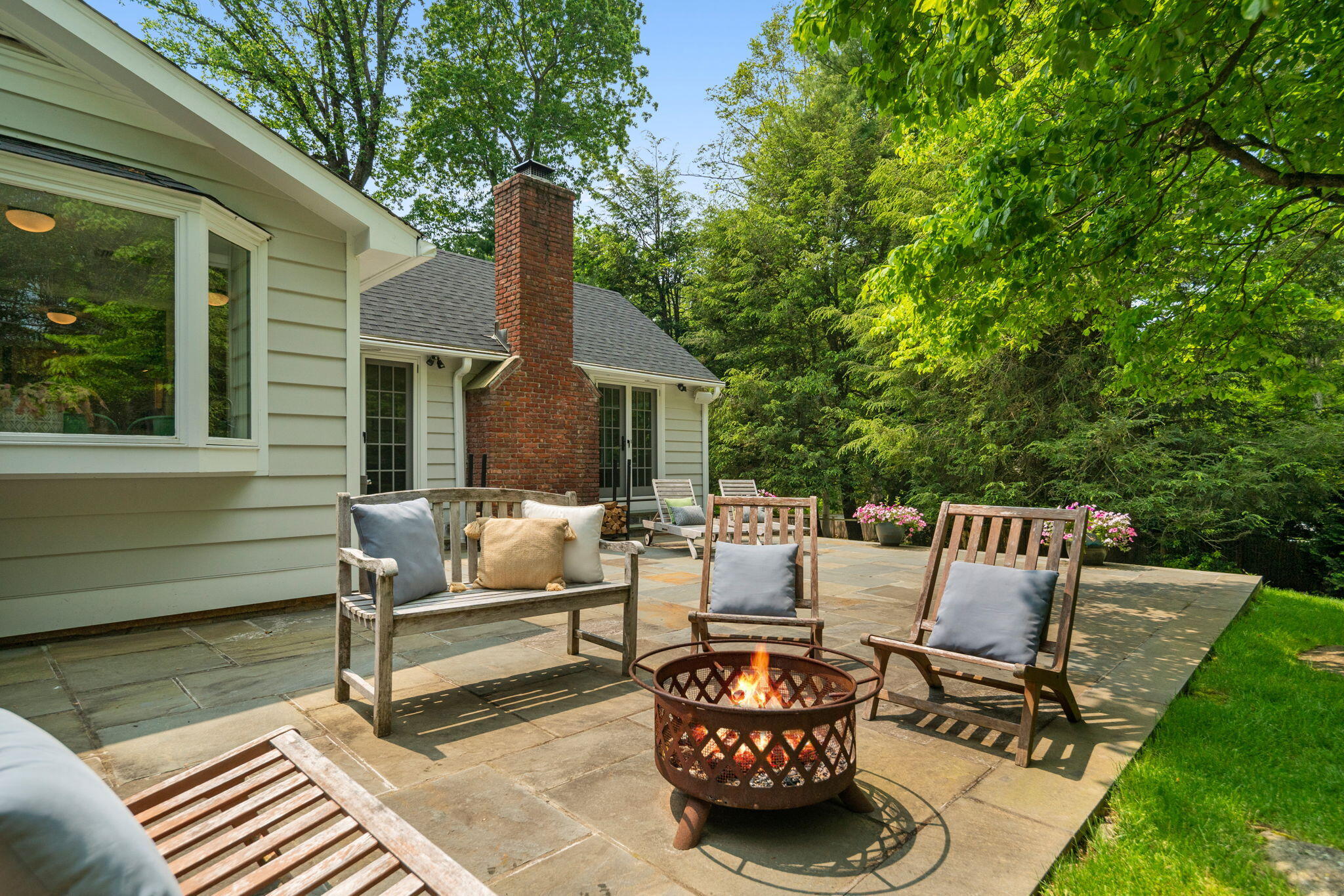 53 Fox Run Road New Canaan, CT 06840 - Photo 29 of 39 a view of a patio with couches chairs and a table and chairs