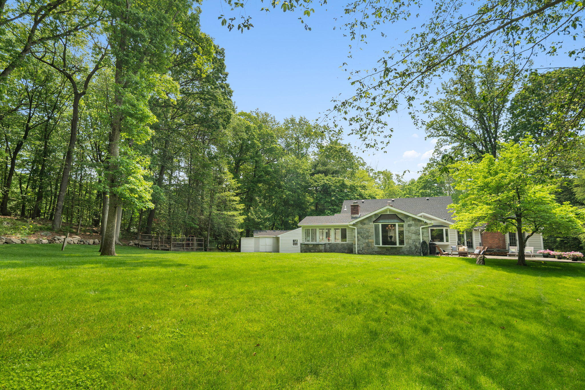 53 Fox Run Road New Canaan, CT 06840 - Photo 31 of 39 a swimming pool with wooden fence