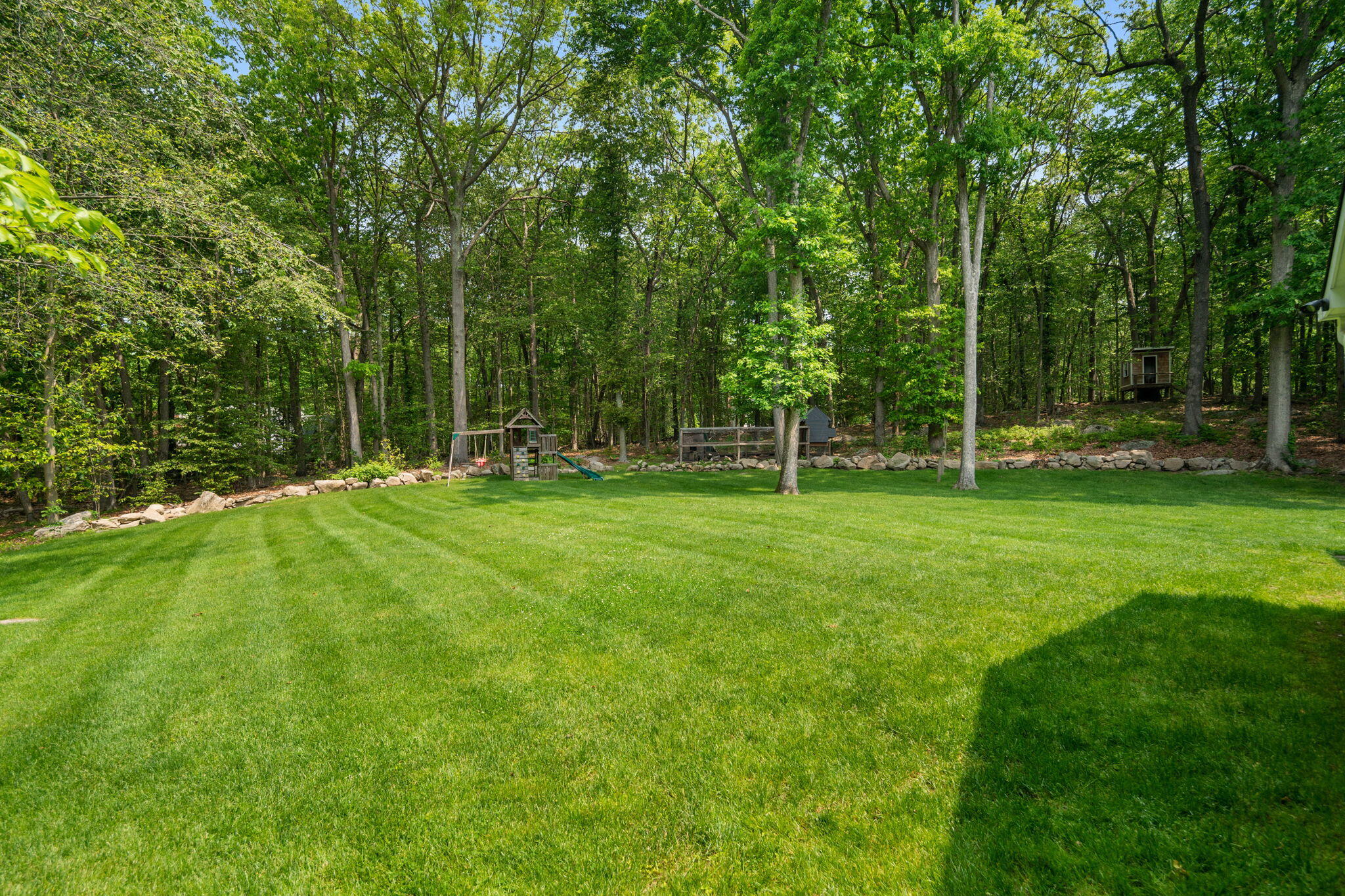 53 Fox Run Road New Canaan, CT 06840 - Photo 33 of 39 a backyard of a house with trampoline