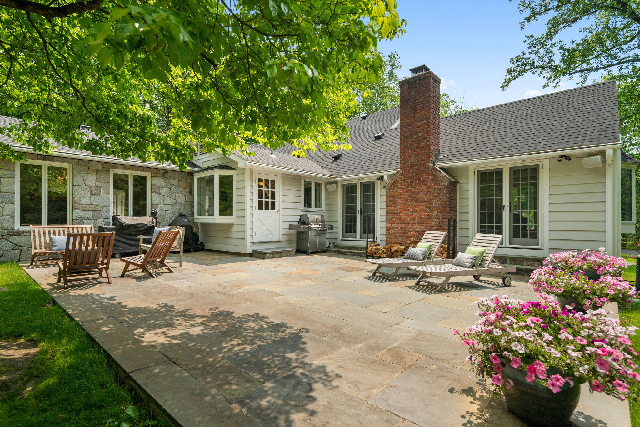 53 Fox Run Road New Canaan, CT 06840 - Photo 4 of 39 a backyard of a house with seating space