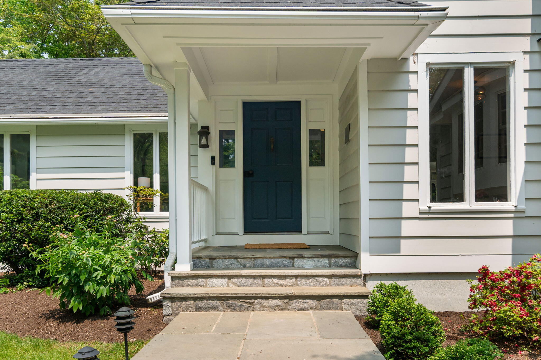 53 Fox Run Road New Canaan, CT 06840 - Photo 5 of 39 front view of a house with potted plants
