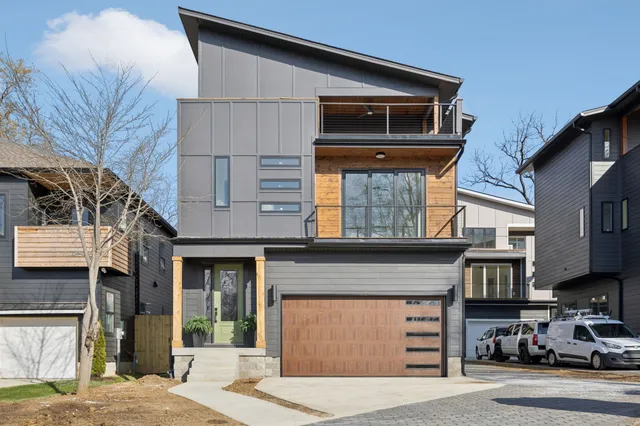a front view of a house with a garage