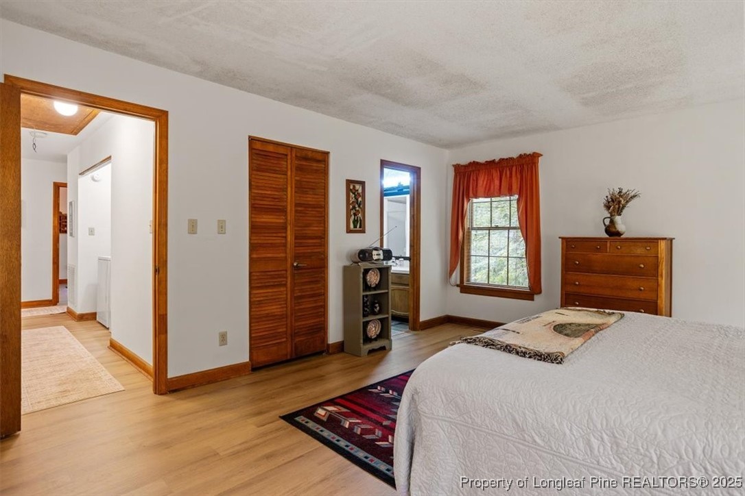 5108 Bridlington Lane Raleigh, NC 27612 - Photo 13 of 19 a bedroom with a bed and a window