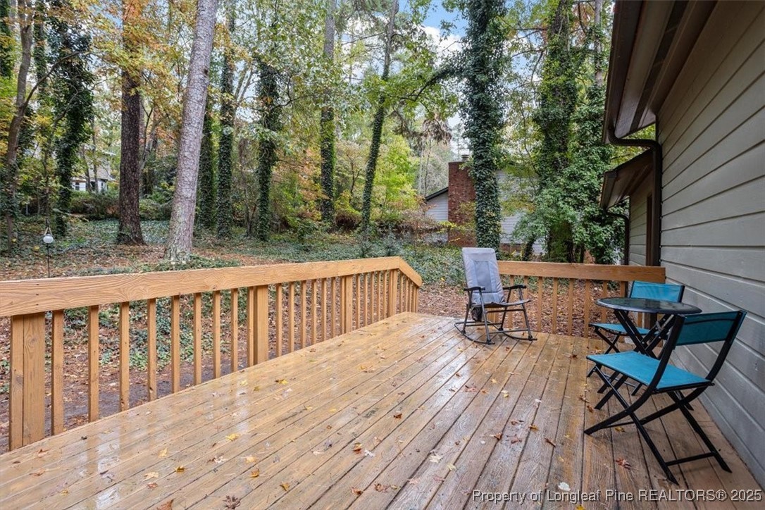 5108 Bridlington Lane Raleigh, NC 27612 - Photo 17 of 19 a view of balcony with wooden floor and outdoor seating