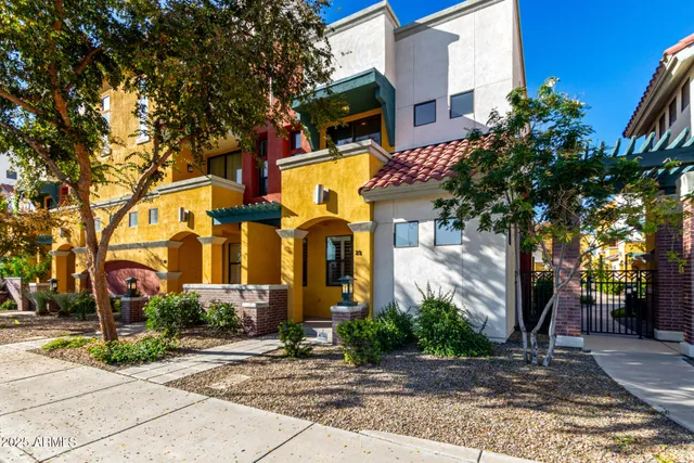 a view of a brick building next to a road