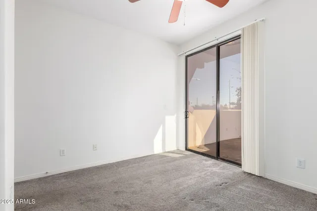 an empty room with sliding glass door