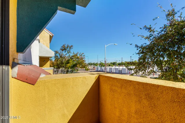a view of a swimming pool and an outdoor space