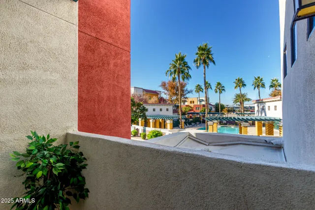 a front view of a building with a garage and a fireplace