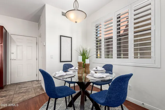 a view of a dining room with furniture and window