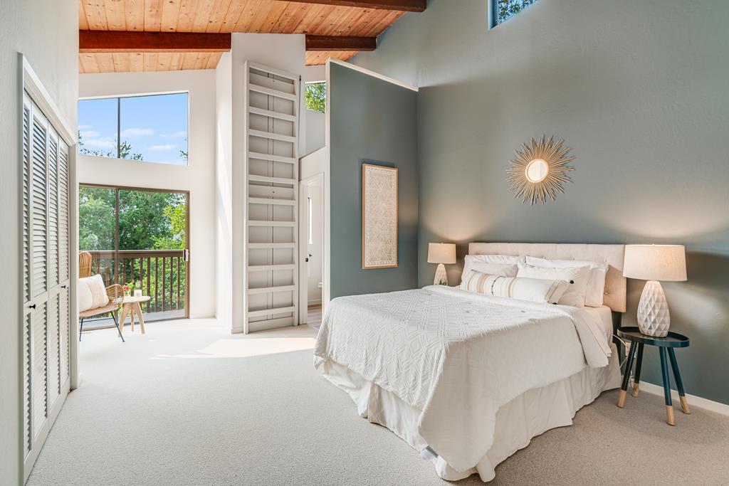 390 Brooktree Ranch Road Aptos, CA 95003 - Photo 21 of 33 a bedroom with a bed and a night stand