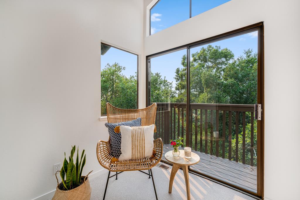 390 Brooktree Ranch Road Aptos, CA 95003 - Photo 28 of 33 a balcony with wooden floor table and chairs