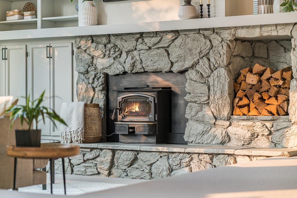 390 Brooktree Ranch Road Aptos, CA 95003 - Photo 6 of 33 a living room with a fireplace and potted plant