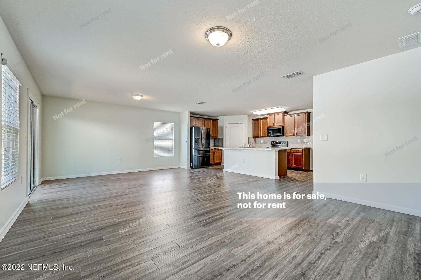 3888 Bronco Road Middleburg, FL 32068 - Photo 6 of 30 a view of a kitchen with furniture and wooden floor