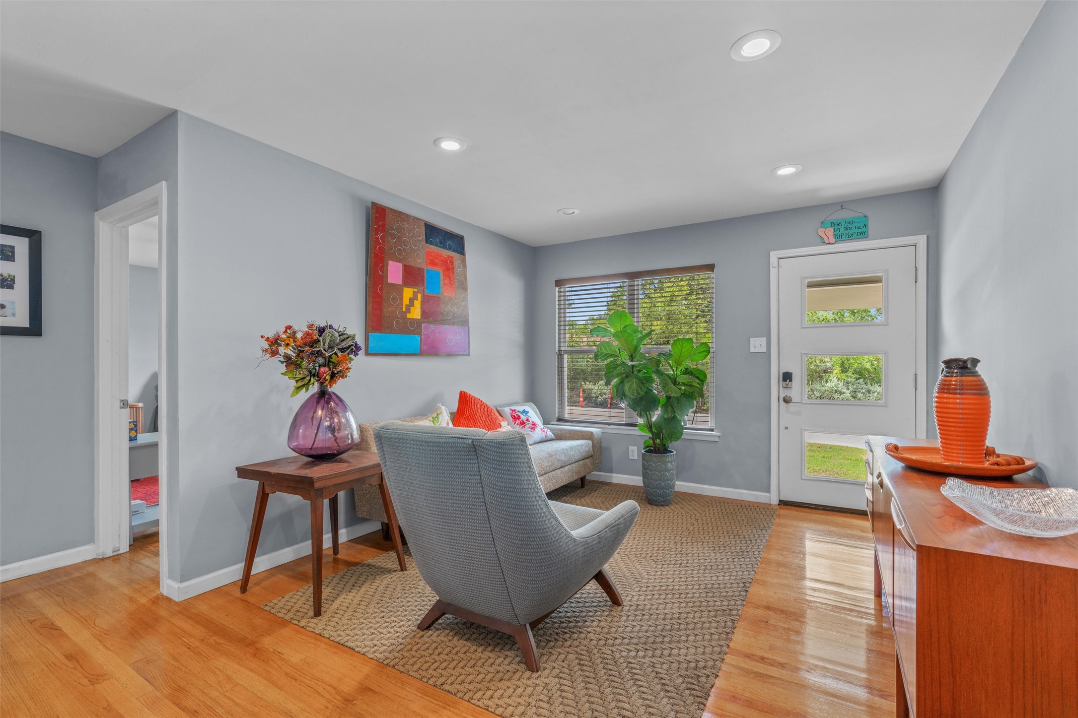 a living room with furniture and a window