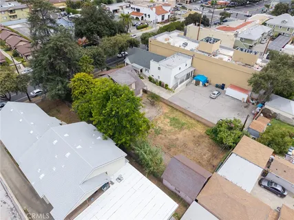 an aerial view of a house with a yard and a garage
