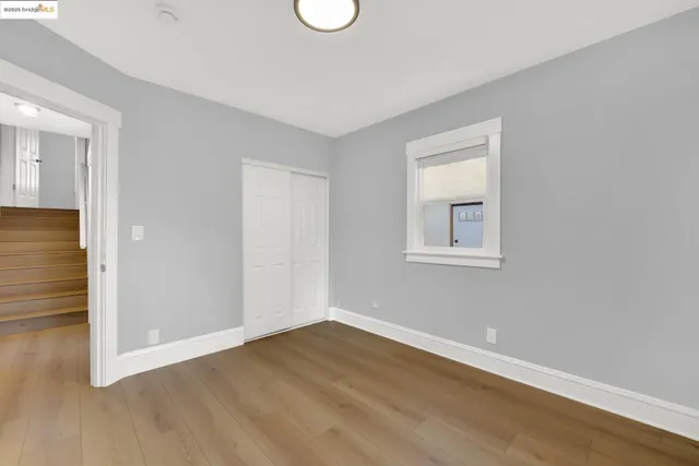 a view of a house with wooden fence