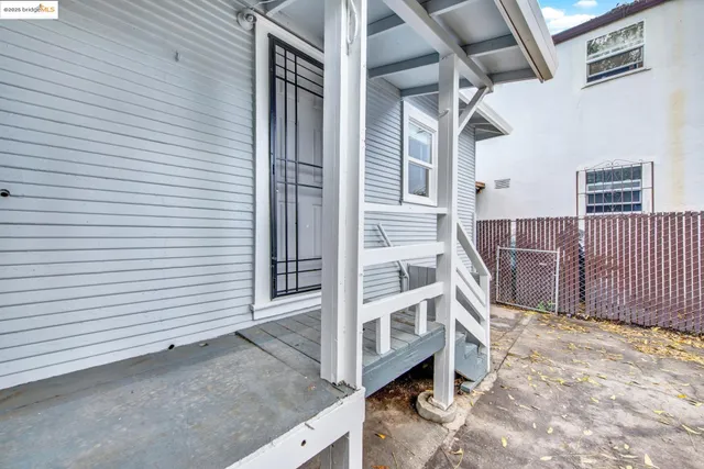 a view of a balcony with wooden floor