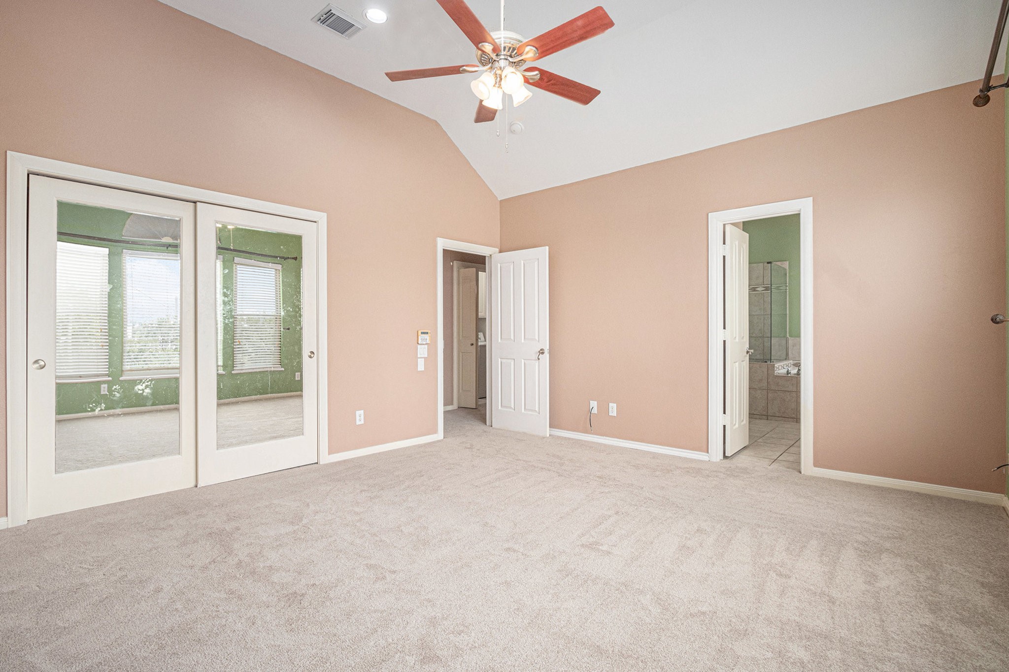 2402 Calumet Street, Unit B Houston, TX 77004 - Photo 19 of 40 an empty room with fan and windows