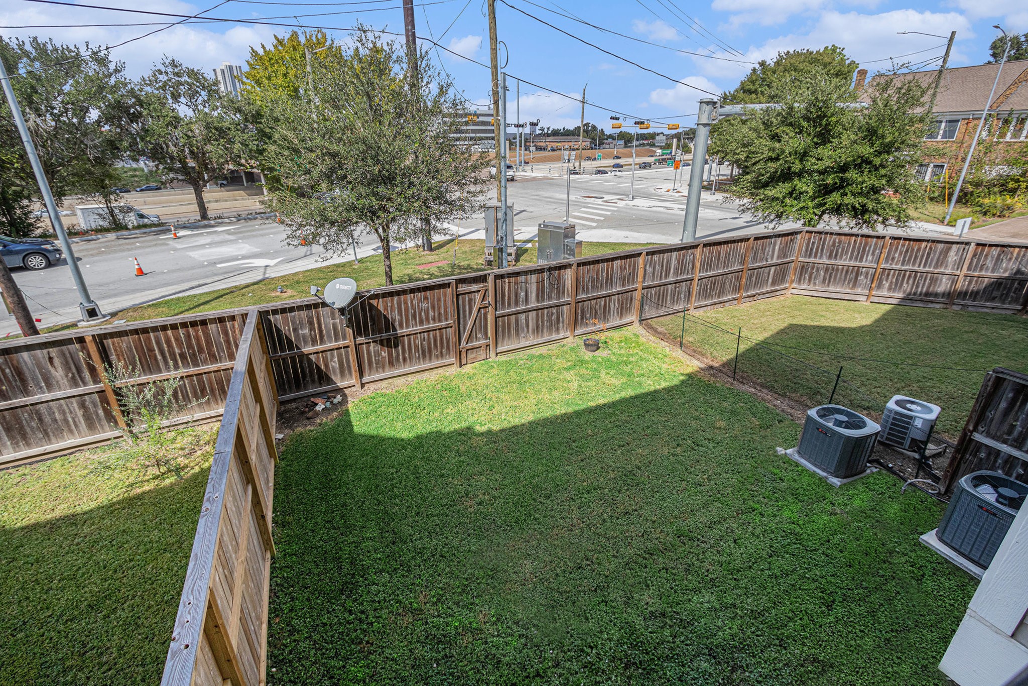 2402 Calumet Street, Unit B Houston, TX 77004 - Photo 34 of 40 a view of a backyard with sitting area and slide
