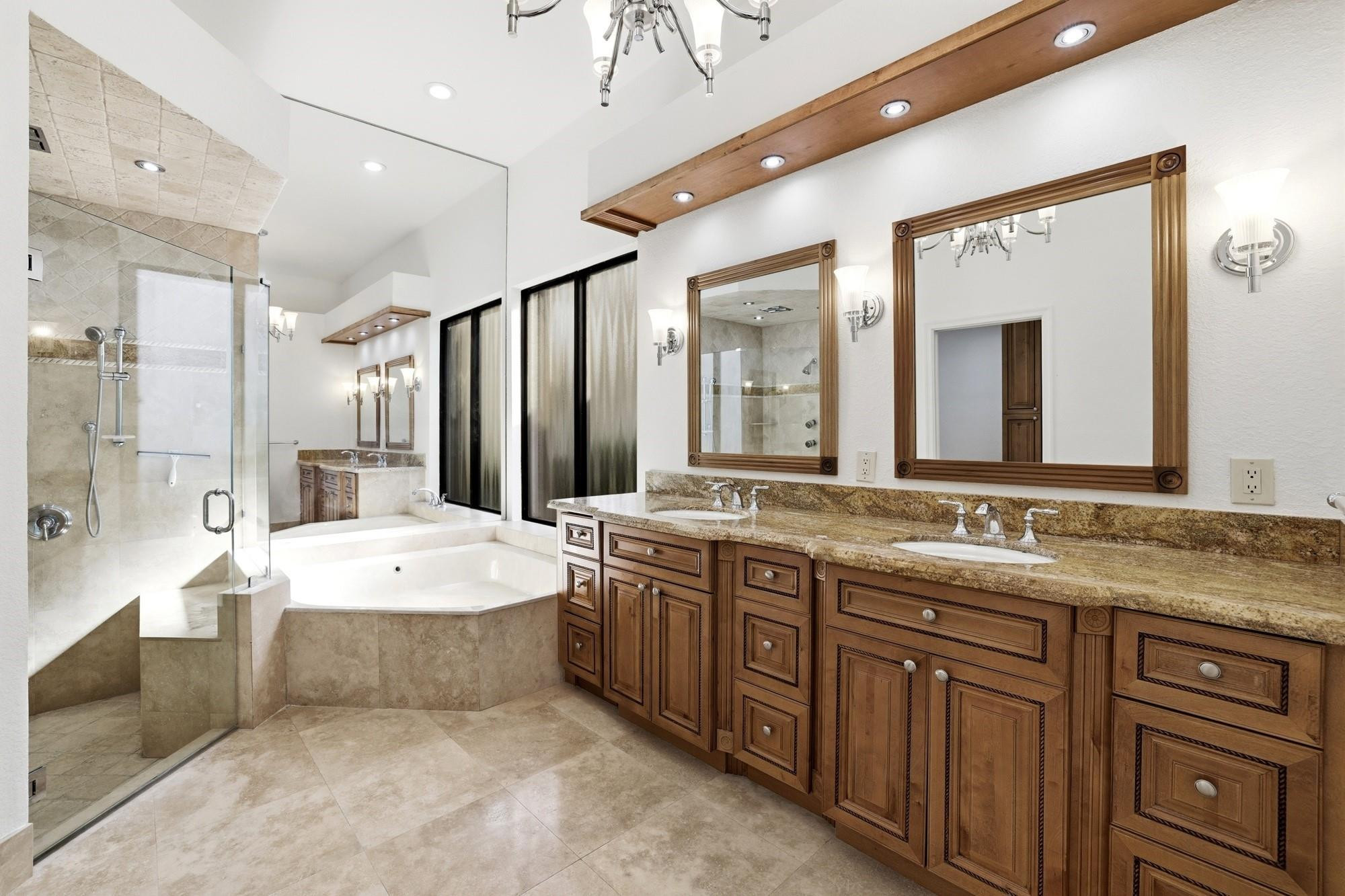 2498 Northwest 63rd Street Boca Raton, FL 33496 - Photo 16 of 39 a spacious bathroom with a granite countertop sink mirror and a