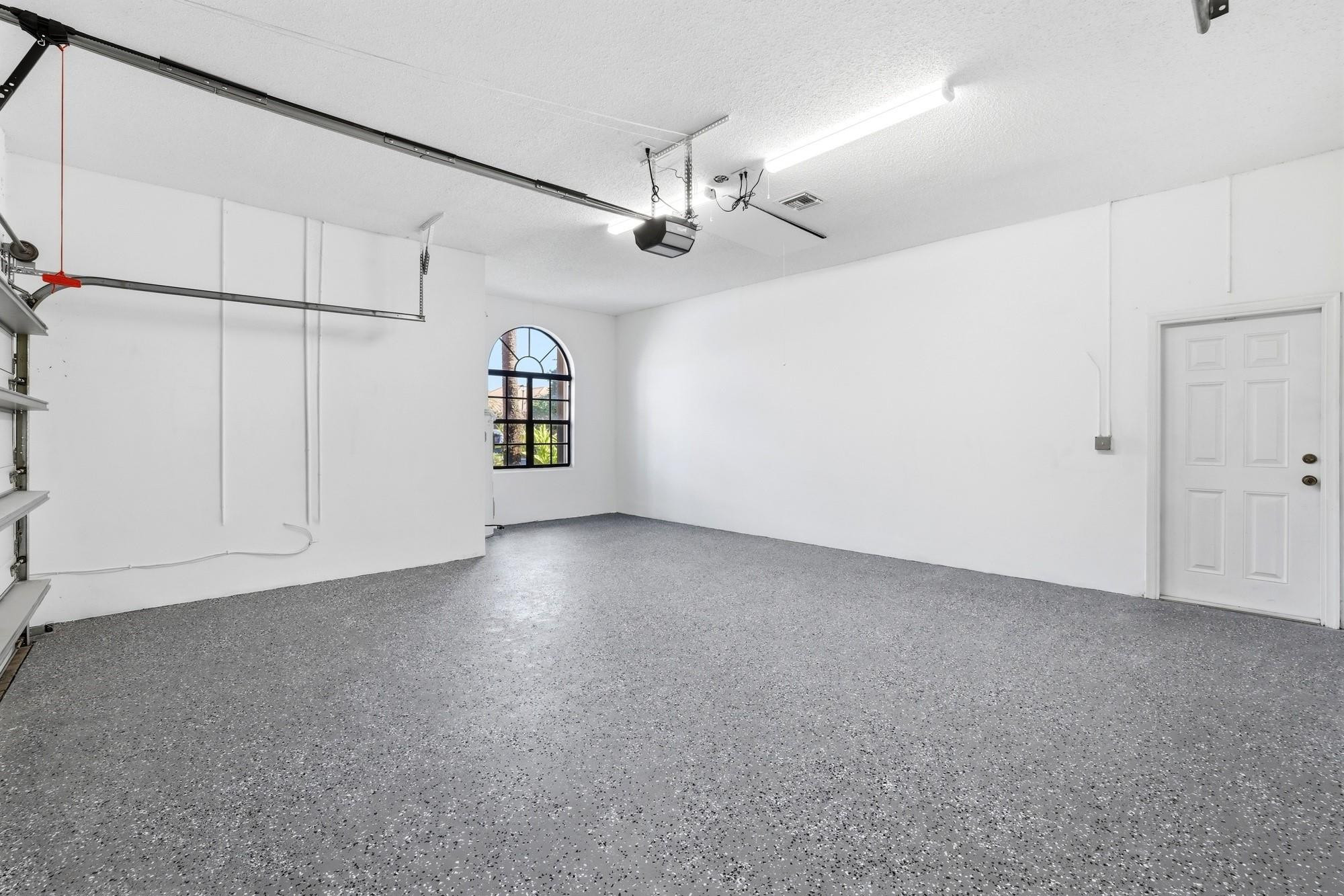 2498 Northwest 63rd Street Boca Raton, FL 33496 - Photo 26 of 39 an empty room with windows and ceiling fan