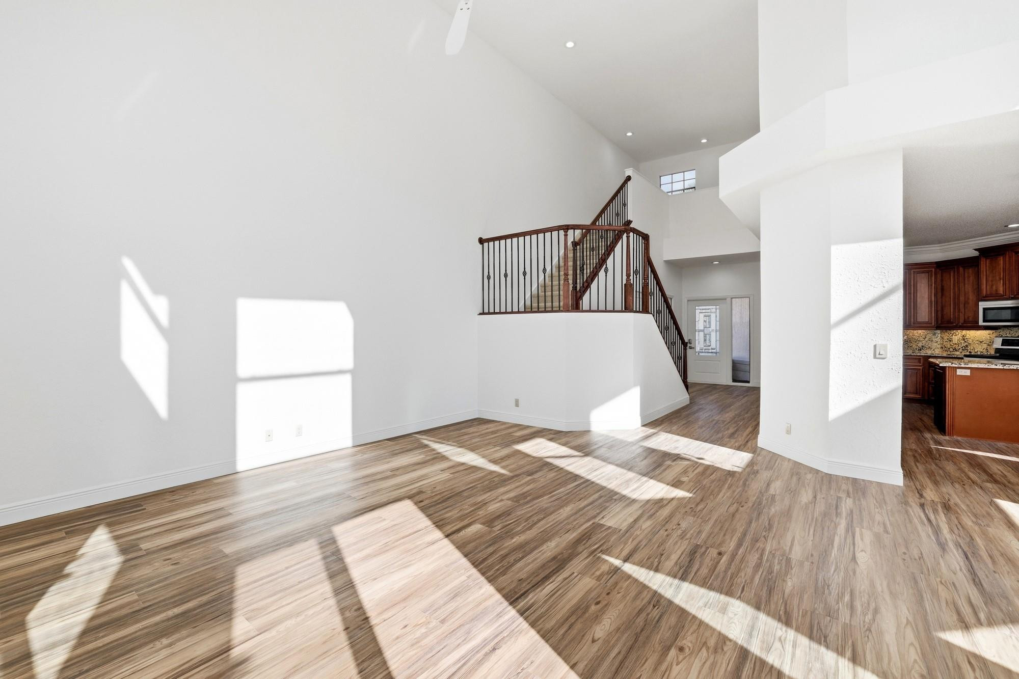 2498 Northwest 63rd Street Boca Raton, FL 33496 - Photo 3 of 39 a bedroom with a bed and a flat tv screen on the dresser