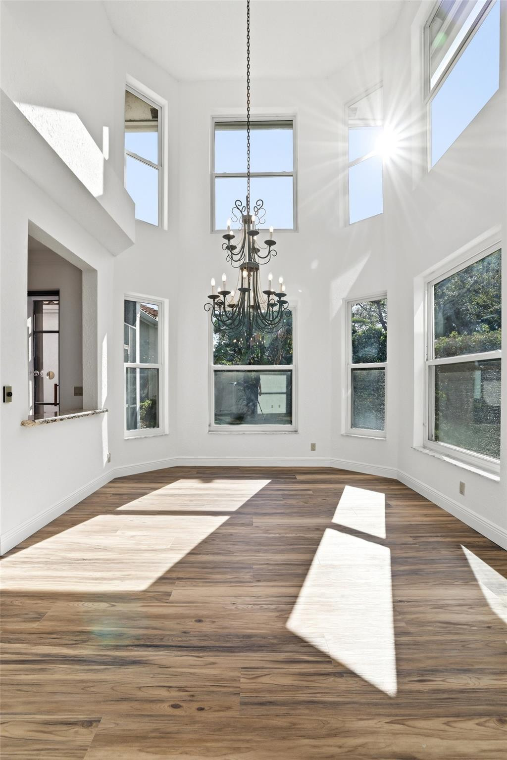 2498 Northwest 63rd Street Boca Raton, FL 33496 - Photo 6 of 39 a view of entryway and hall with wooden floor