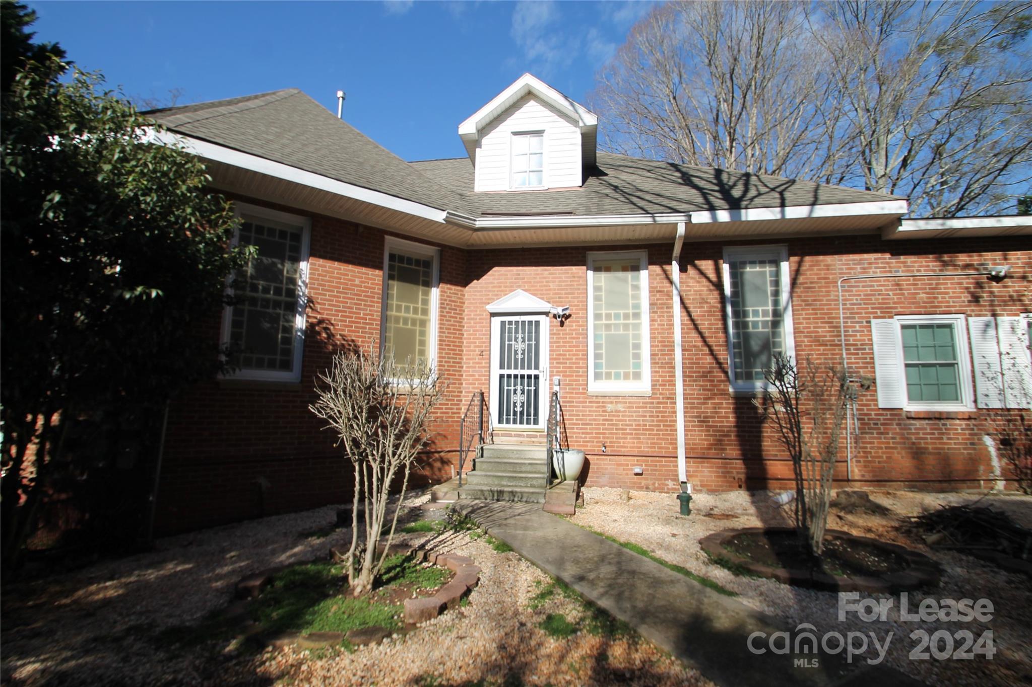 112 Steele Street, Unit 4 Fort Mill, SC 29715 - Photo 1 of 10 a front view of a house with garden