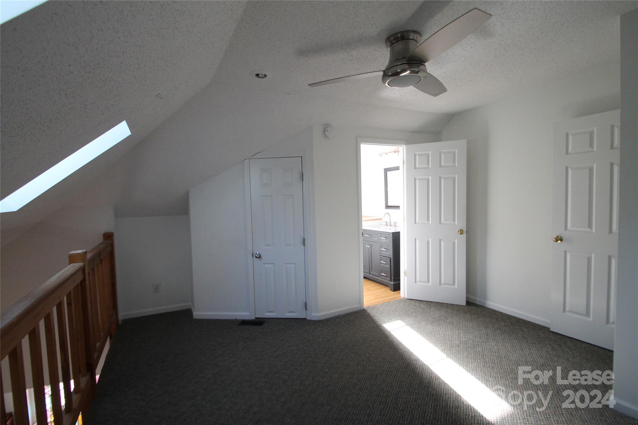 112 Steele Street, Unit 4 Fort Mill, SC 29715 - Photo 6 of 10 a view of a hallway with a ceiling fan