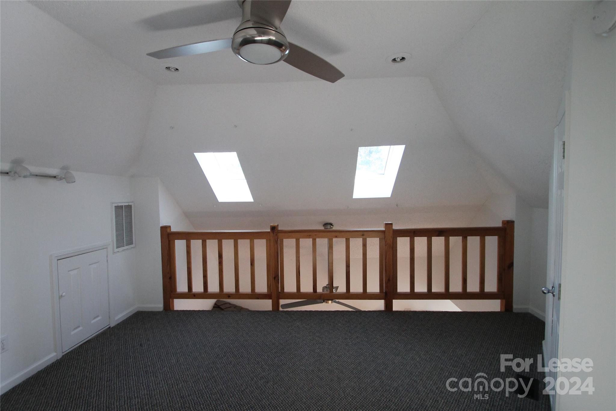 112 Steele Street, Unit 4 Fort Mill, SC 29715 - Photo 7 of 10 an empty room with windows