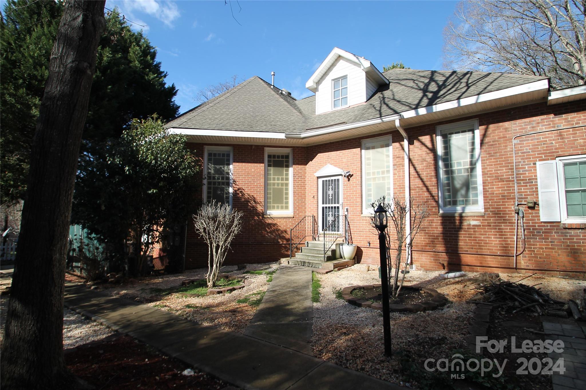 112 Steele Street, Unit 4 Fort Mill, SC 29715 - Photo 10 of 10 a front view of a house with garden