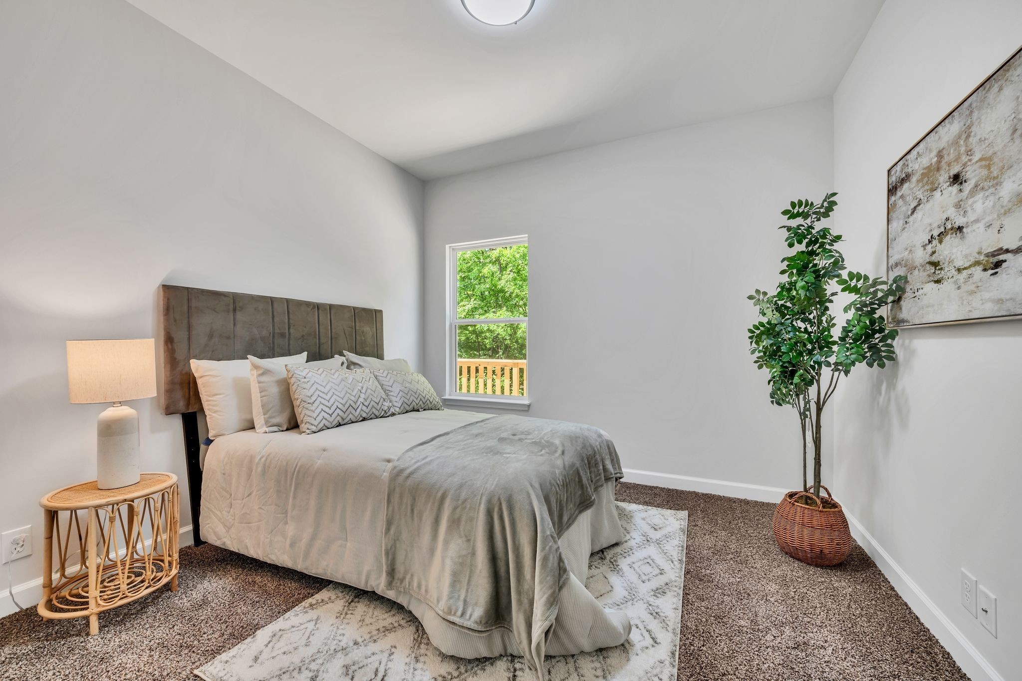317 Lewis Hollow Road Dickson, TN 37055 - Photo 17 of 30 a bedroom with a bed and a potted plant