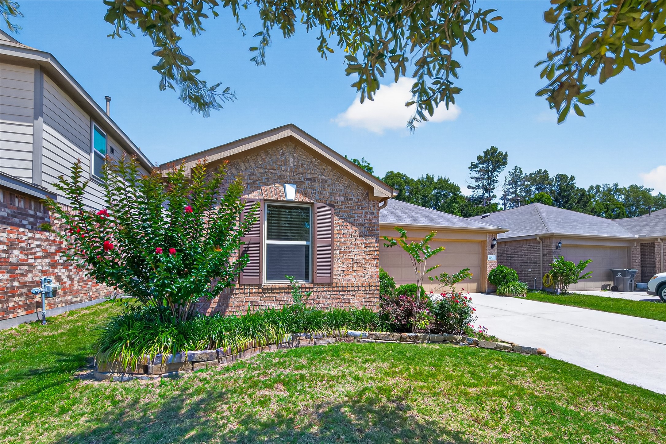 2754 Cayden Creek Way Conroe, TX 77304 - Photo 37 of 40 a front view of a house with a yard
