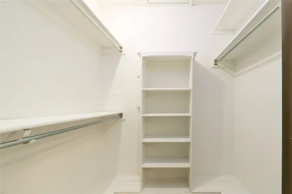 a view of an empty walk in closet