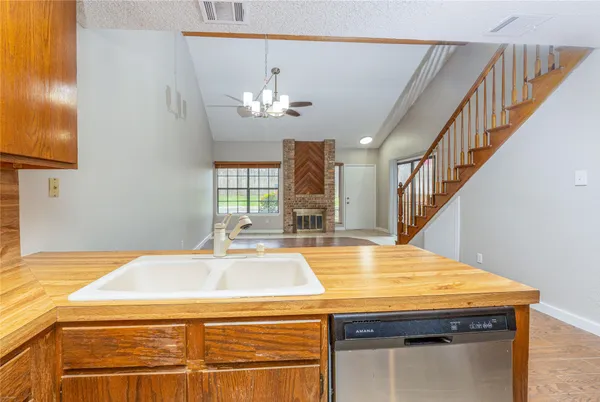 a room with pool table and windows