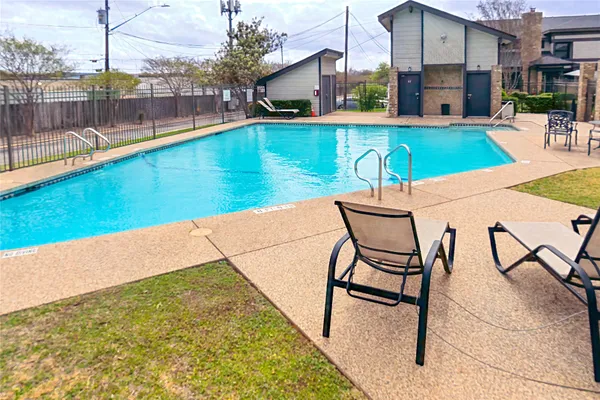 a view of swimming pool with outdoor seating